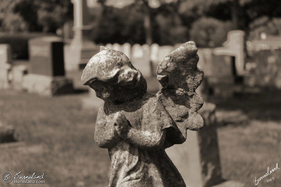 An angel prays atop a grave marker at the Mount Hebron Cemetery in Winchester, Virginia.