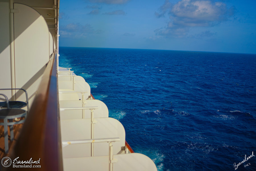 Looking out at the blue water of the Caribbean from our stateroom verandah on the Disney Fantasy during our 2022 Disney Cruise