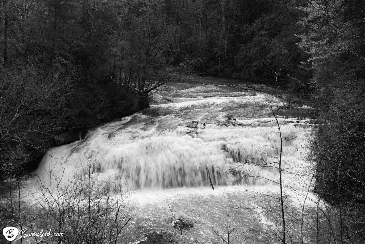 Rushing water pours over the rocks at the middle falls at Burgess Falls State Park in Tennessee