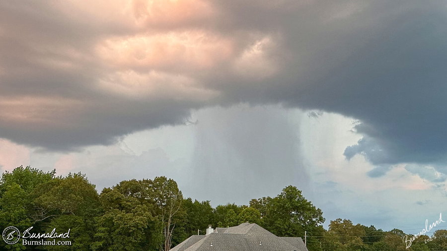 A rain shower surrounded by low clouds